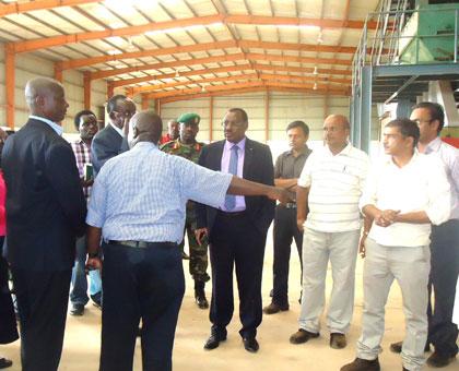 Government officials tour the plant to assess constraints to production. (Stephen Rwembeho)