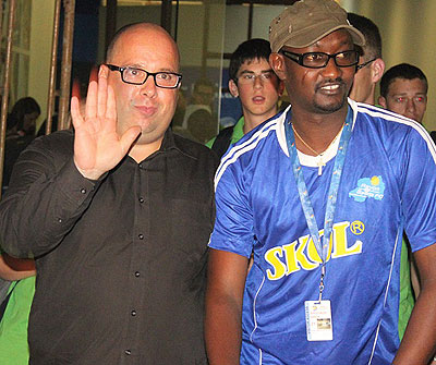 Coach Jean Francois Losciuto (L) waving to fans alongside Olivier Gakwaya, the club's new Marketing Manager. Courtesy.