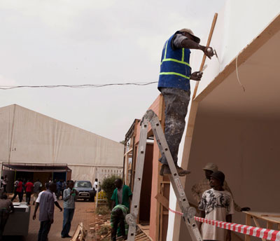 Some of the exhibitors setting up their stalls yesterday in preparation for tomorrows opening. The New Times / T. Kisambira.