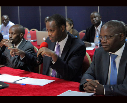 Inspector General of Courts Francois Regis Rukundakuvuga (C) speaks at the meeting as High Court president Charles Kaliwabo (L) and Apollinaire Mupiganyi look on. John Mbanda.