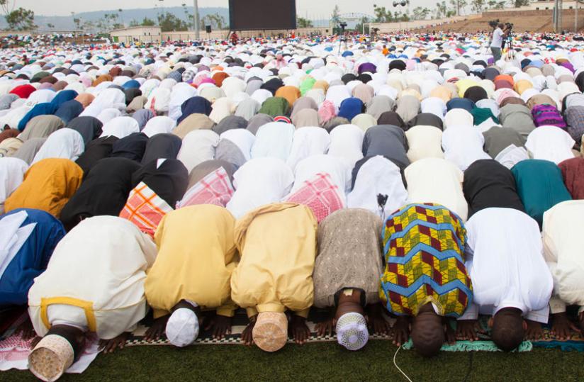 Hundreds of Muslims celebrated the end of the holy month of Ramadan at Kigali Regional Stadium in Nyamirambo. (Timothy Kisambira)