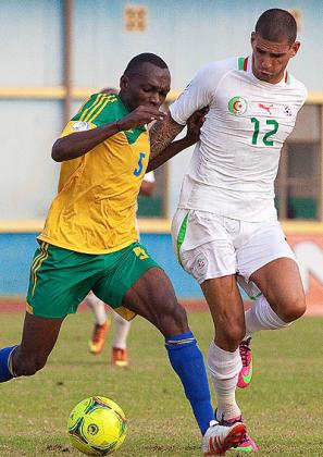 Amavubi striker Meddie Kagere takes on an Algerian defender in a past match. He scored  the winner against Gabon on Sunday in Libreville.