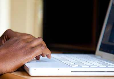 A man uses a laptop to surf the net. Hackers are increasingly put Internet users on their toes. However, efforts by the government to deter the vice should restore hope among users. 