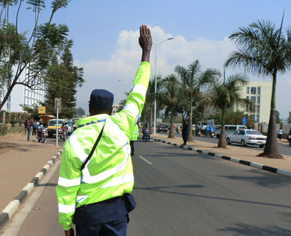 A traffic police officer pulls over a driver in Kacyiru, Kigali last week. Timothy Kisambira. 
