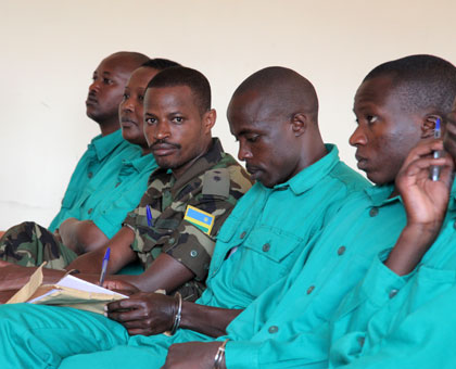 Joel Mutabazi (in military fatigue) and his co-accused in court. (John Mbanda)