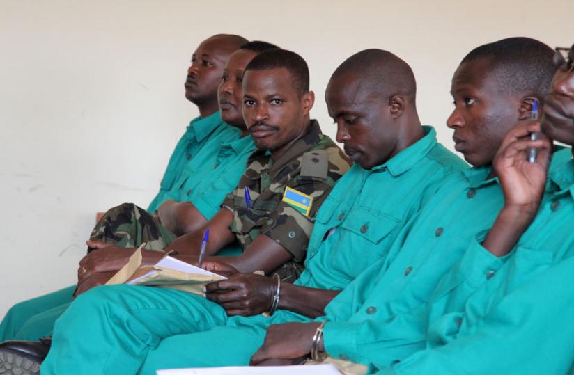 Joel Mutabazi (in military fatigue) and his co-accused in court. (John Mbanda)rn