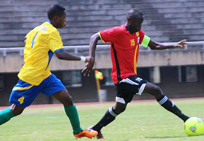 Junior Wasps defender Jean Claude Tuyishime chases Uganda Cubs skipper during the first leg two weeks ago in Kampala. Rwanda needs to win 5-0 to progress to next round. Courtesy.