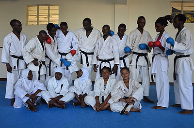 Members of the team pose for a picture together with national team coach, Ruslan Adamov, on Thursday after a morning training session. Sam Ngendahimana.