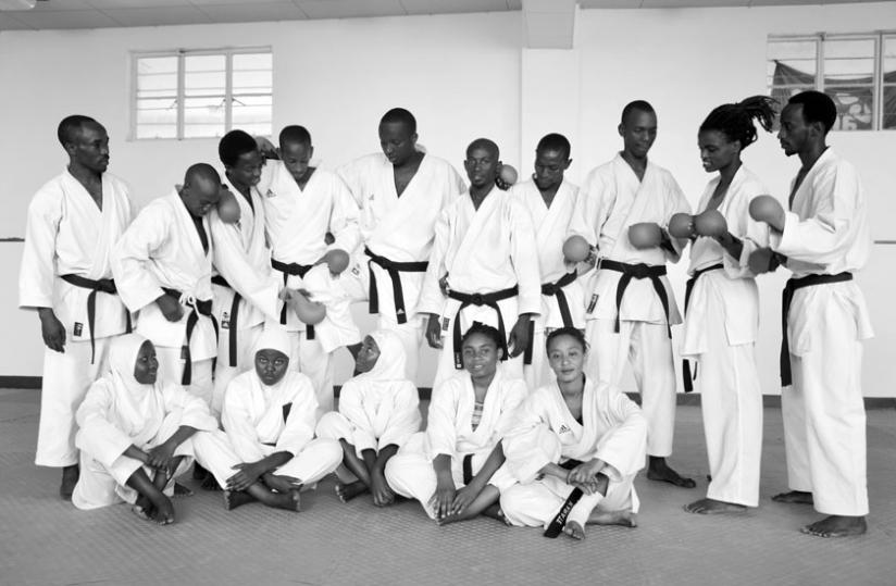 Members of the team pose for a picture together with national team coach, Ruslan Adamov, on Thursday after a morning training session. (Sam Ngendahimana)