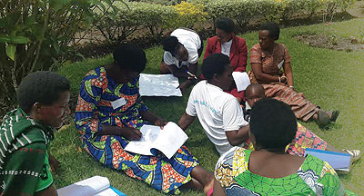 Some of the women, who attended the training in Rulindo District last week, discuss what they studied. The New Times / Peterson Tumwebaze.