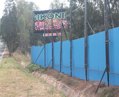 A fence thought to have been erected by Nsengiyumva that is enclosing  Aflinku2019s digital Billboard (In the background). Athan Tashobya. 