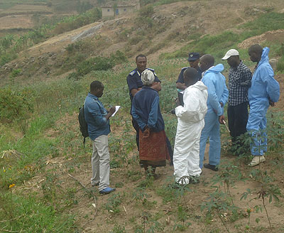 Detectives and forensic experts cordon off the scene of crime on Saturday as  investigations into the murders continue.  Courtesy.