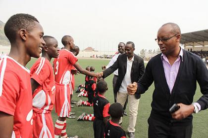 FERWAFA Vice president Vedaste Kayiranga greets Kayonza FTC squad before the final match.