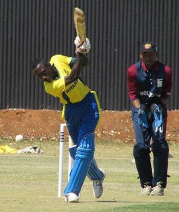 Eric Niyomugabo strikes a long drive during the game against Swaziland on Sunday.  Courtesy