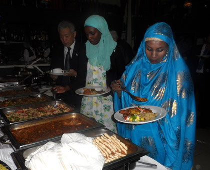 Guests serve food. (Moses Opobo)