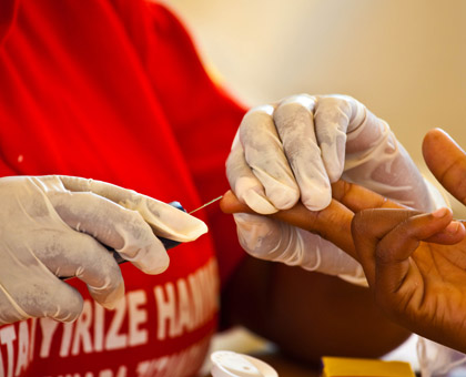 A patient testing for HIV. (Timothy Kisambira)