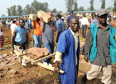 Residents of Kanombe construct a school during a past Umuganda exercise. File