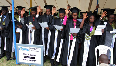 Medical graduates take oath at the inaugural graduation of University of Rwanda in Kigali yesterday. John Mbanda.