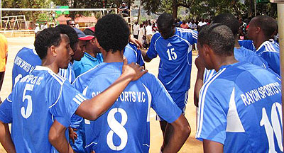 Rayon Sports Volleyball players listen to their coach. File