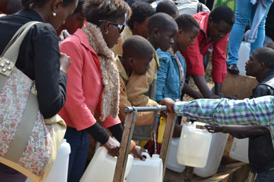 Water of Life: While thousands were busy in mass, others queued to fetch from Maryu2019s Fountain in Kibeho. File.