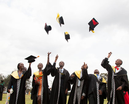 Graduates celebrate after getting their degrees at University of Rwanda's maiden graduation ceremony yesterday. Timothy Kisambira.