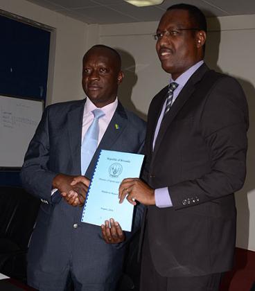 Former minister of sport and culture, Protais Mitali, hands over to the new minister, Joseph Habineza .Sam Ngendahimana.