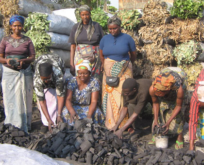 Women vend charcoal. A new report says women should be allowed time to engage in productive work that would have an impact on the countryu2019s economy. (File)