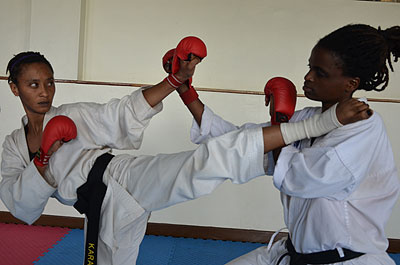 Rehema Kebera, left, spares with team mate Solange Ingabire at Amahoro stadium.  S. Ngendahimana