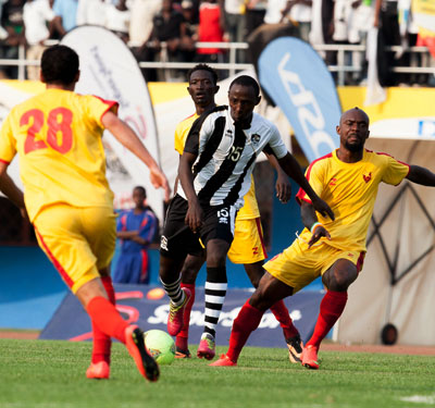 APR midfielder Andrew Buteera tries to go past three El Merreikh players during the final on Sunday. T. Kisambira