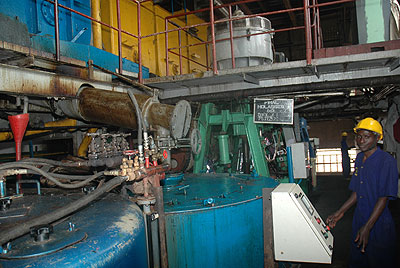 A machine operator at work inside Kabuye Sugar Works factory. (John Mbanda)