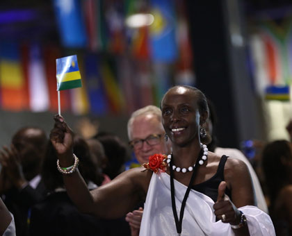 A participant at the Rwanda Day 2013 in Toronto, Canada, proudly waves the National Flag. Atlanta city in the US will host the 2014 version. File.