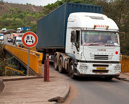 Trucks cross Rusumo border. Truck drivers have persistently complained of several non-tariff barriers along the Central Corridor. T.Kisambira.