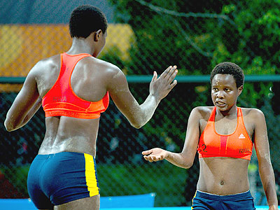Seraphine Mukantambara, left , and Lea Uwimbabazi celebrate winning a set during their victory over Argentina. Courtesy