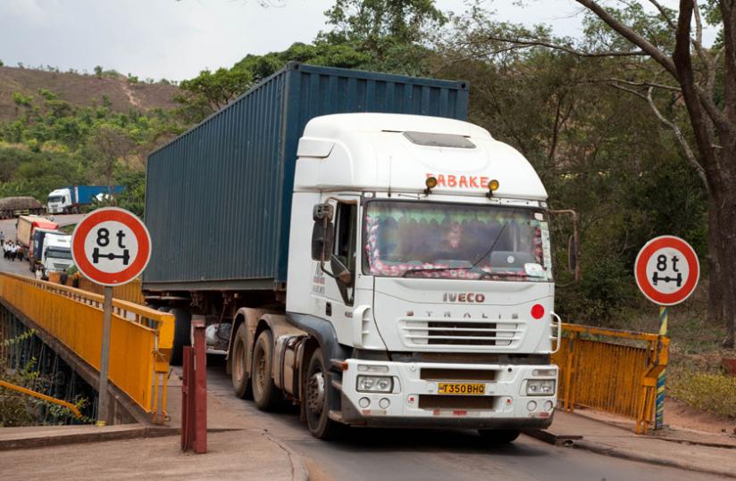 Trucks cross Rusumo border. Truck drivers have persistently complained of several non-tariff barriers along the Central Corridor. (Timothy Kisambira)