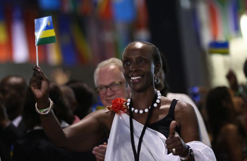 A participant at the Rwanda Day 2013 in Toronto, Canada, proudly waves the National Flag. Atlanta city in the US will host the 2014 version. (File)