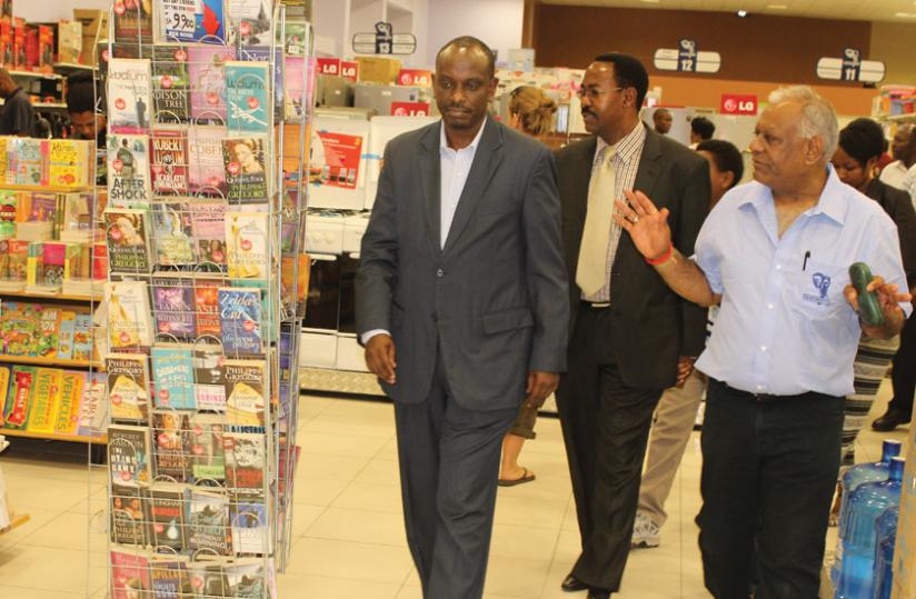 Amb. Sezibera (left) and Arusha mayor Gaudence Lyimo on a guided tour of Nakumattu00e2u20acu2122s 50th store in Arusha by Shah (right). Courtesy.