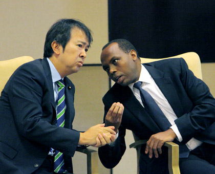RDB chief executive Francis Gatare (R) chats with Japanese parliamentary vice minister for Foreign Affairs Hirotaka Ishihara during a consultative meeting on investments in Kigali yesterday. (John Mbanda)
