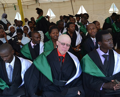 Hakizimana with colleagues during last weeku2019s graduation. He has defied stigma and is now a fresh graduate from the College of Education. (Jean du2019Amour Mbonyinshuti)