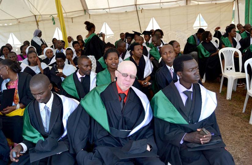 Hakizimana with colleagues during last weeku00e2u20acu2122s graduation. He has defied stigma and is now a fresh graduate from the College of Education. (Jean du00e2u20acu2122Amour Mbonyinshuti)