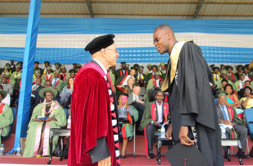 Ambroise Jean-Louis gets the confidence vote of Dr Ou00e2u20acu2122Neal, during the University of Rwandau00e2u20acu2122s maiden graduation last week. (Timothy Kisambira)
