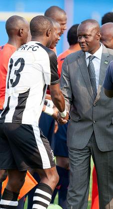 Sports and Culture Minister Joseph Habineza greets players and officials before kickoff of the Kagame Cup final between APR and El Merreikh. (T. Kisambira)