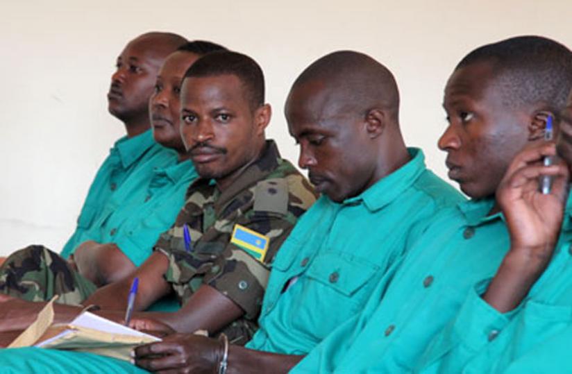 Joel Mutabazi (in military fatigue) and his co-accused in court. (John Mbanda)