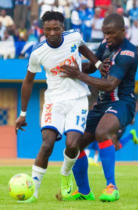 Bertrand Yossa, left, seen here in action against Azam in the Kagame Cup, is one of three  players, set to sign for Rayon Sports. T. Kisambira