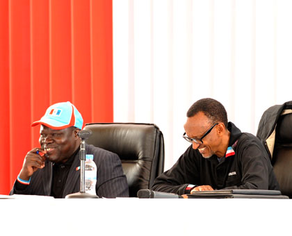 President Kagame and party vice chairperson Christophe Bazivamo (L) at the Rwanda Patriotic Front Political Bureau meeting at Petit Stade in Remera in Kigali yesterday. (Village Urugwiro)