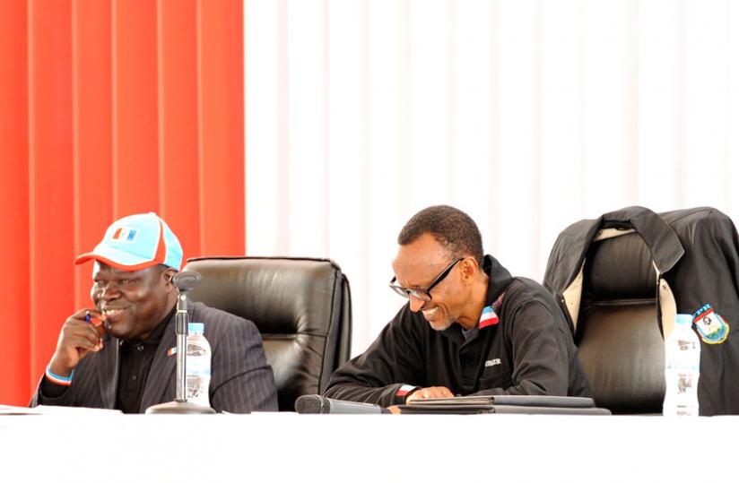 President Kagame and party vice chairperson Christophe Bazivamo (L) at the Rwanda Patriotic Front Political Bureau meeting at Petit Stade in Remera in Kigali yesterday. (Village Urugwiro)