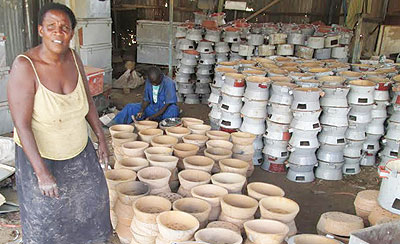 Improved stove makers wait for customers. The innovation has attracted lukewarm reception from city residents. File.