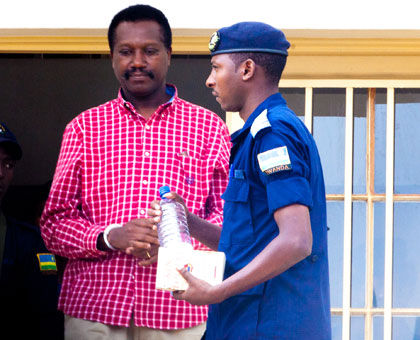 Kabuye leaves the court after pre-trial hearing yesterday. T. Kisambira.