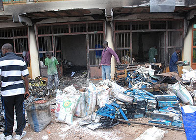 Traders try to salvage some of the property burnt in the late night fire yesterday. (Jean Pierre Bucyensenge)