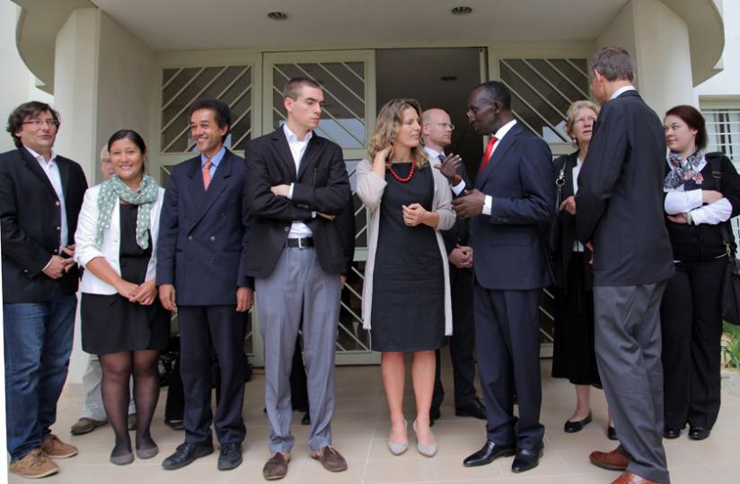 Chief Justice Prof. Sam Rugege (R) chats with Anna Von Harmer as the other members of the delegation look on after the meeting yesterday. (John Mbanda)