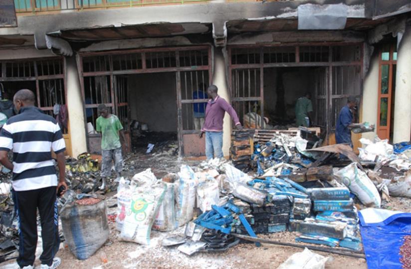 Traders try to salvage some of the property burnt in the late night fire yesterday. (Jean Pierre Bucyensenge)